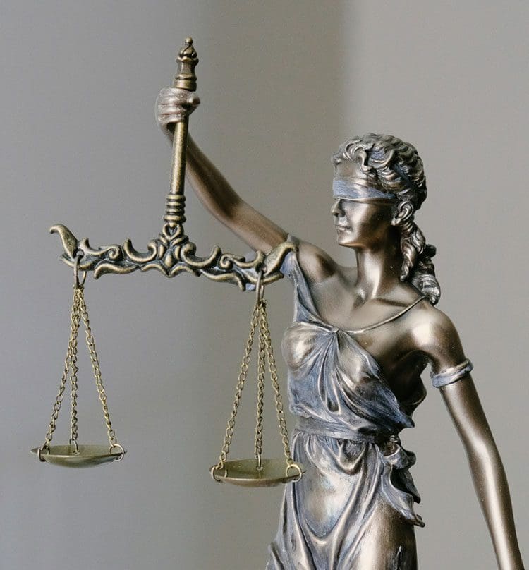 A statue of lady justice holding the scales.